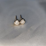 Round Tapered Bezel-Set Stud Earring in 9ct white gold-The Diamond Setter