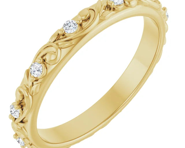 Yellow gold floral inspired wedding band with round diamonds set along the band with elegant and detailed design