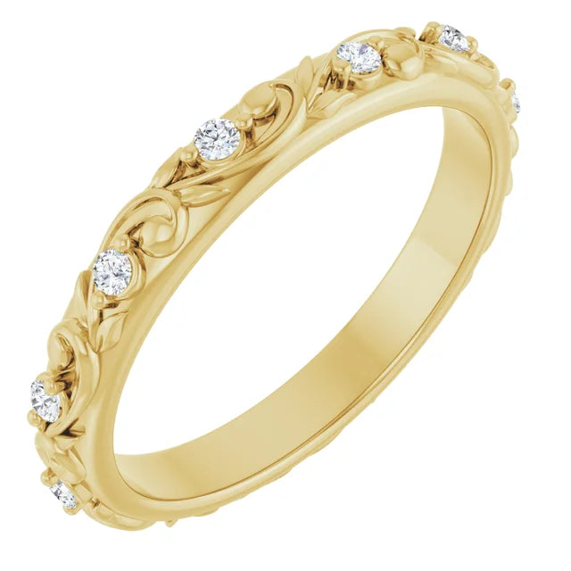 Yellow gold floral inspired wedding band with round diamonds set along the band with elegant and detailed design