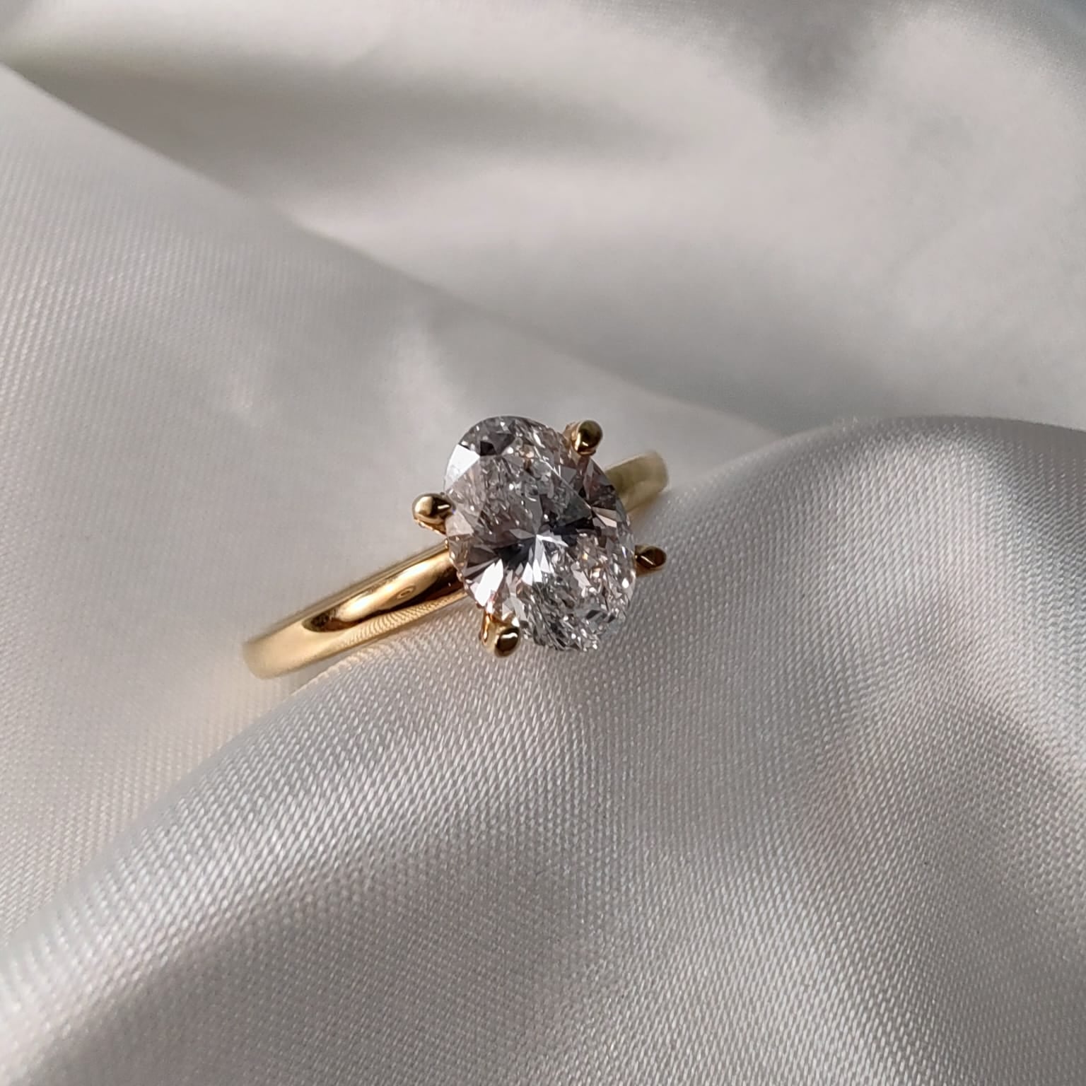 18ct Yellow Gold Oval Solitaire Engagement Ring with Diamond-Set Claws-The Diamond Setter