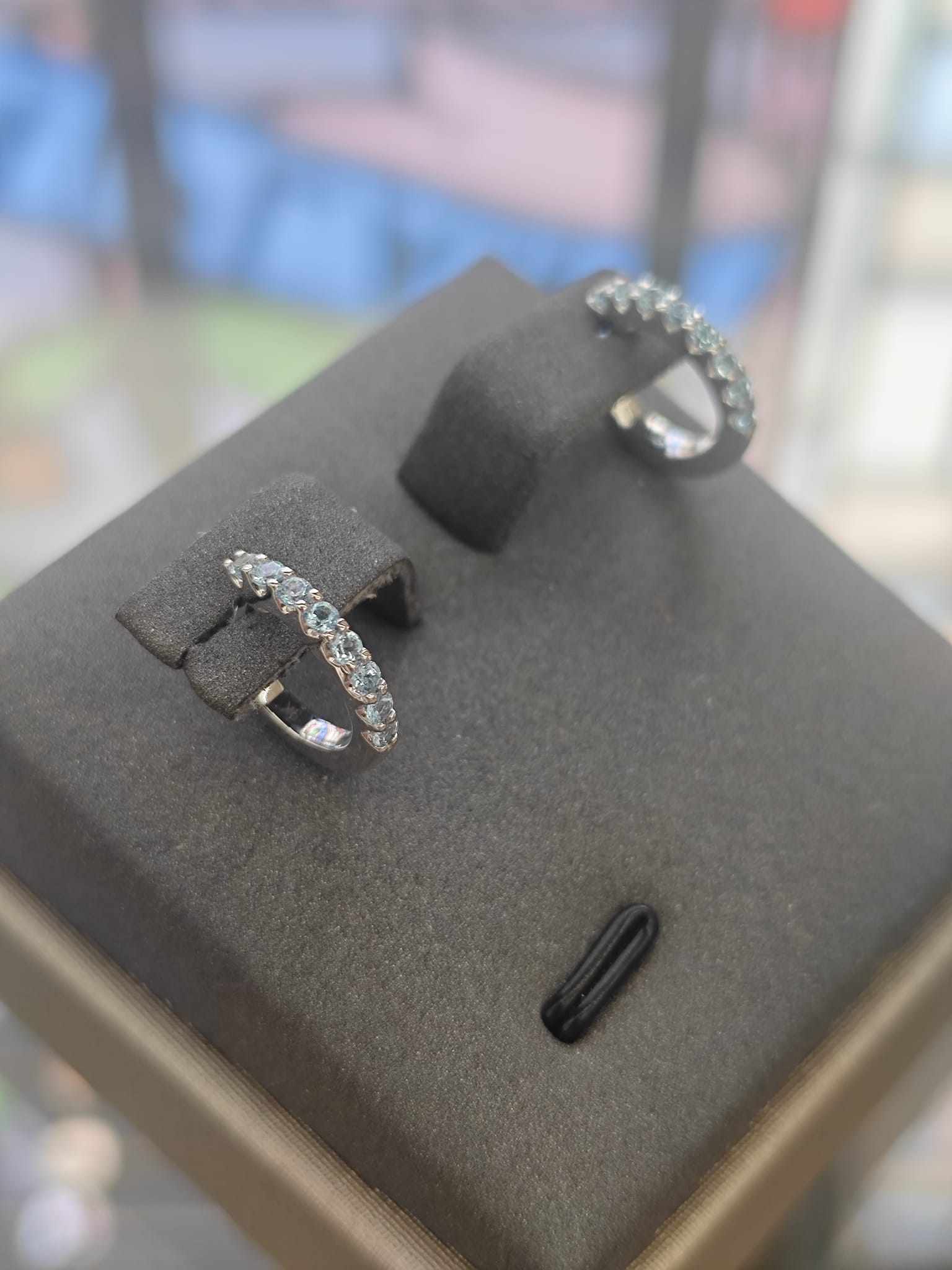 9ct White Gold Blue Topaz Huggie Earrings-The Diamond Setter