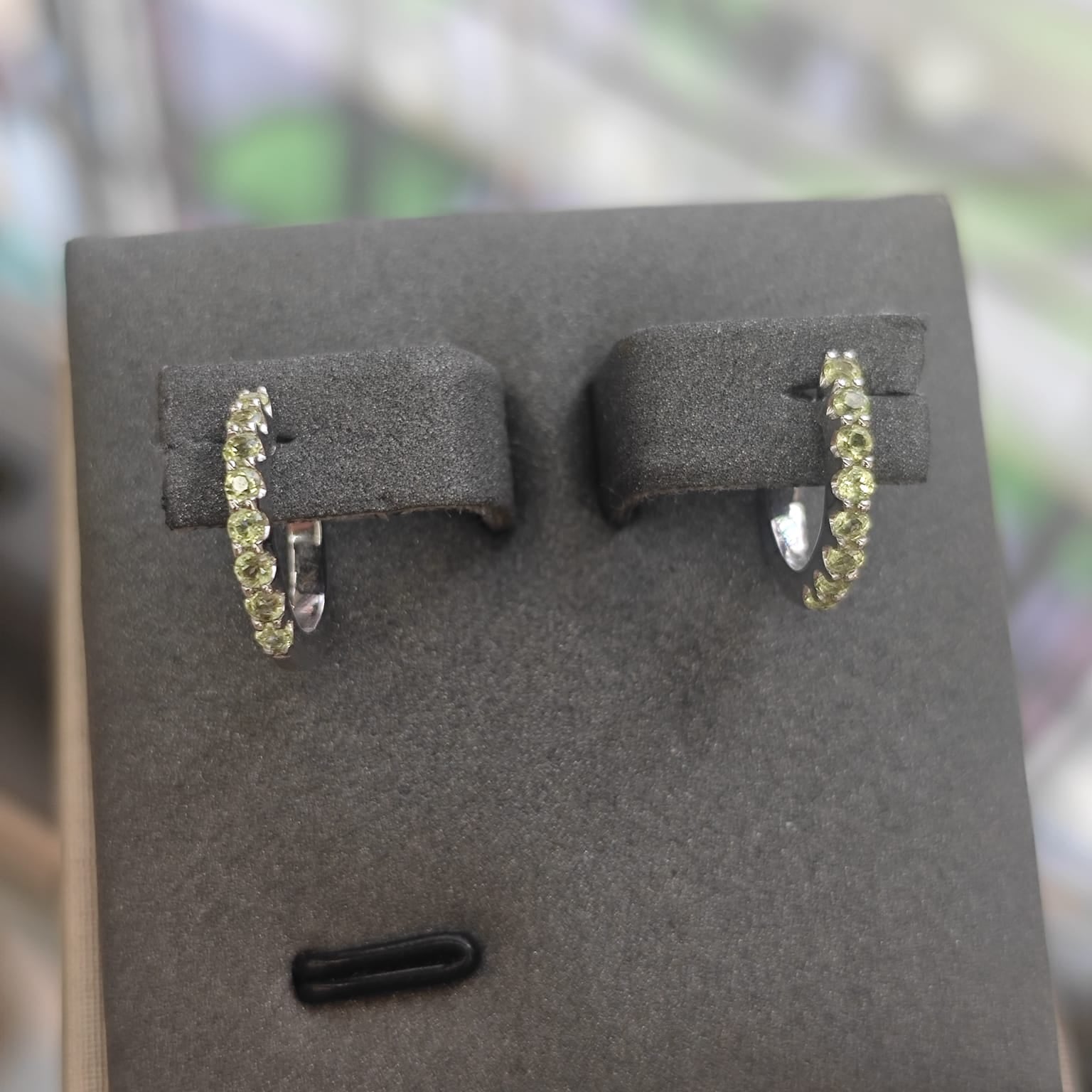 9CT White Gold Peridot Huggie Earrings-The Diamond Setter