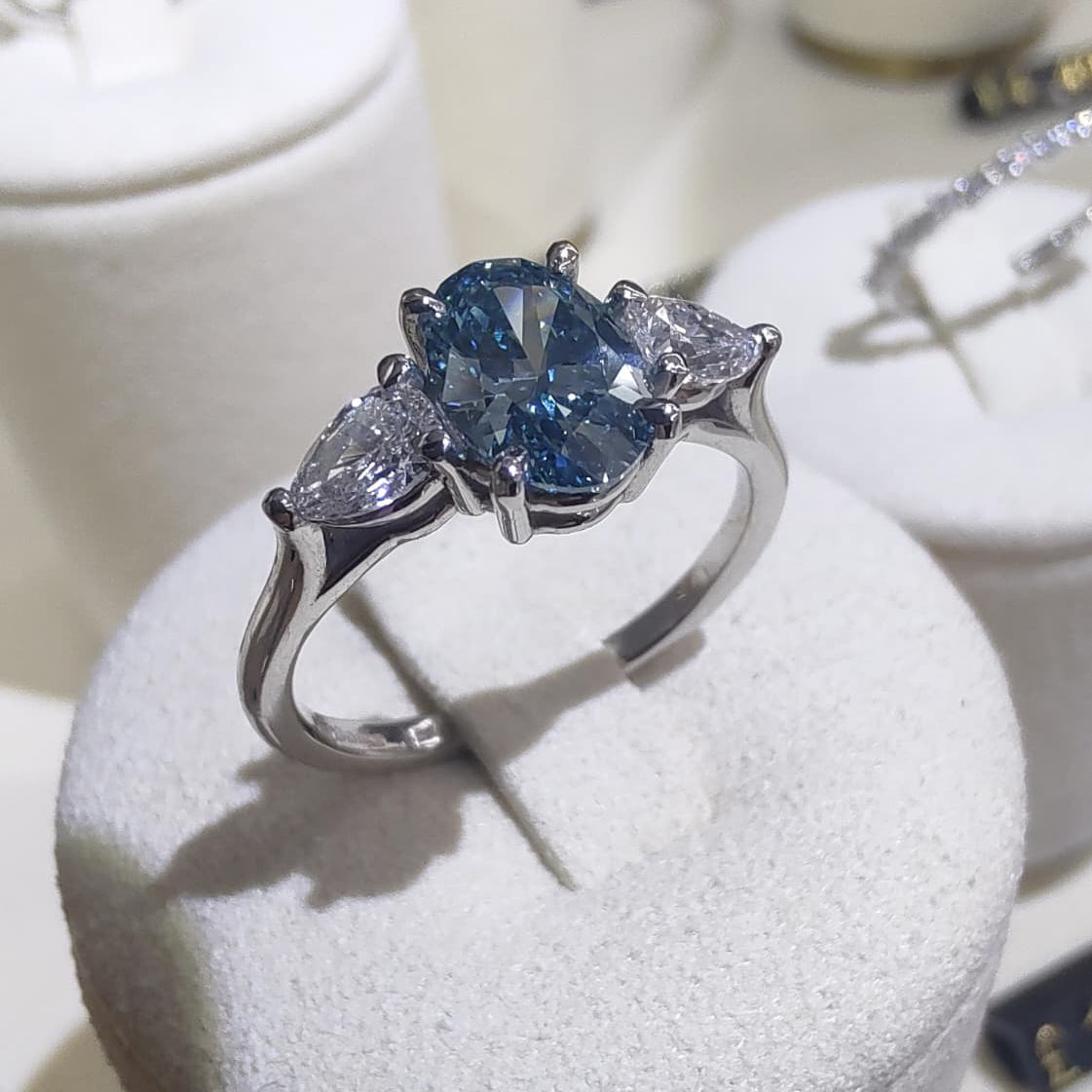 Platinum 1ct Oval Cut Blue Diamond Trilogy Engagement Ring-The Diamond Setter