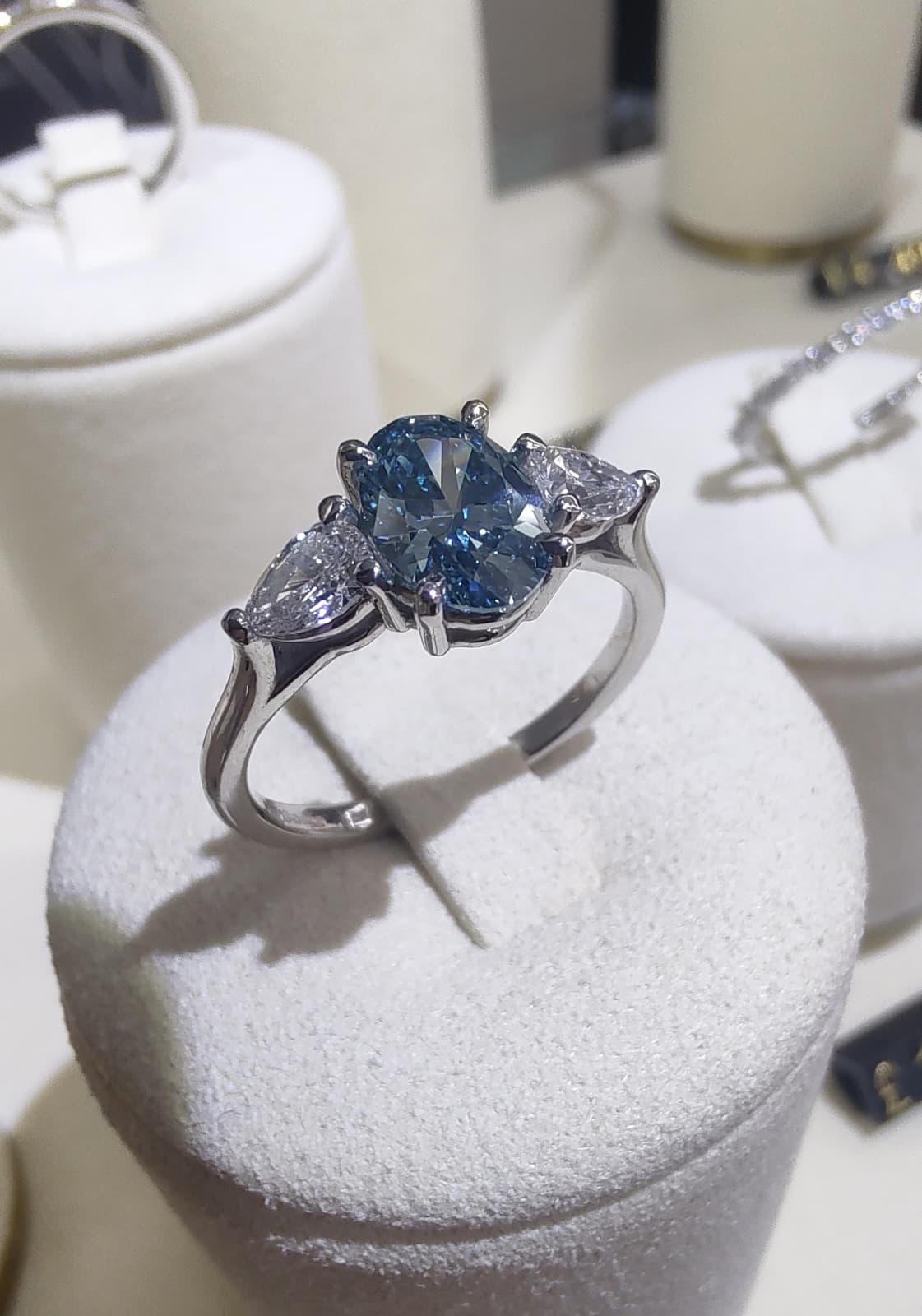 Platinum 1ct Oval Cut Blue Diamond Trilogy Engagement Ring-The Diamond Setter