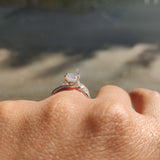 Round French-Set Bypass Engagement Ring with blue diamond accents-The Diamond Setter