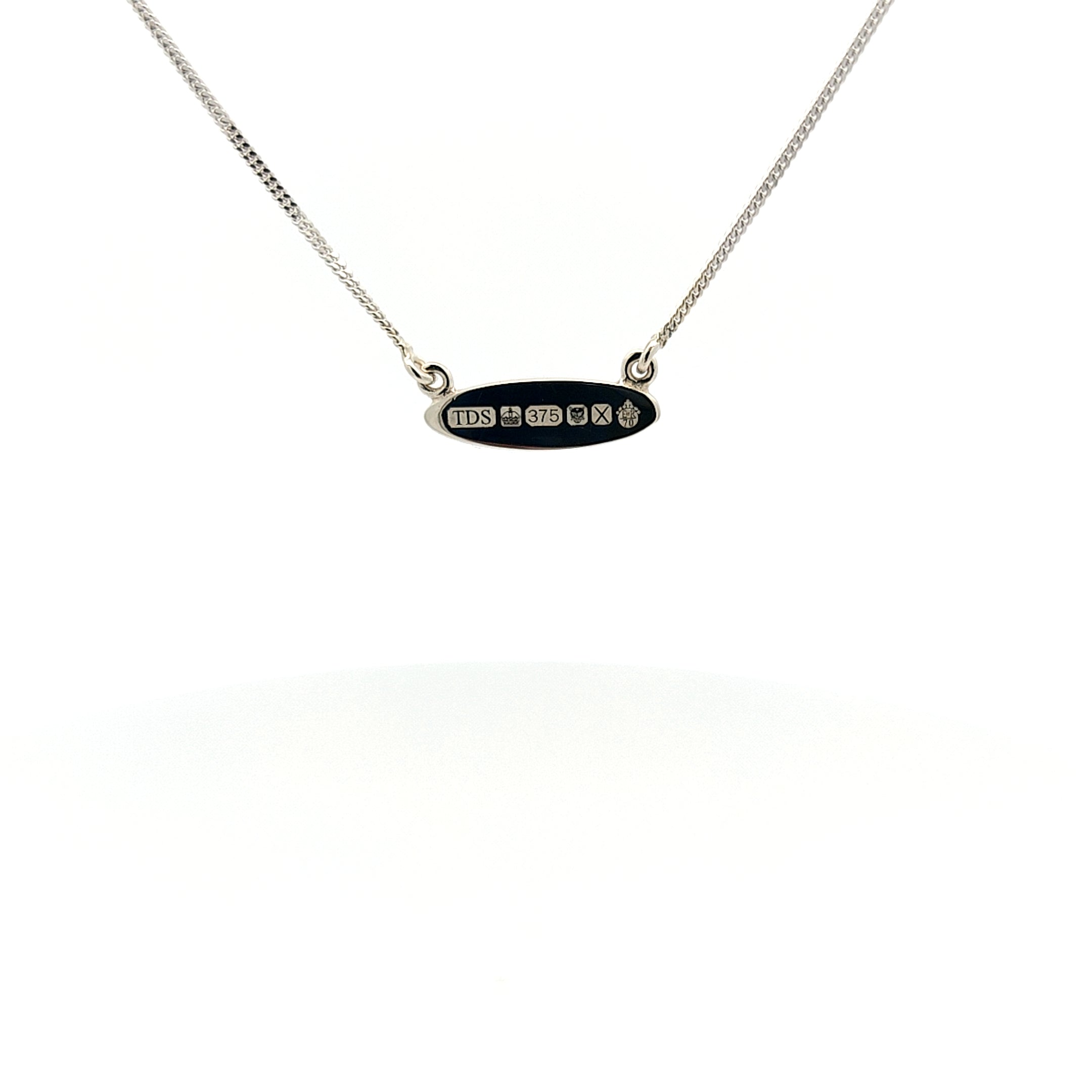 Petit oval pendant with platinum jubilee hallmark-The Diamond Setter